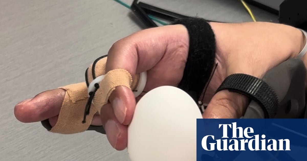 Brain implant helps paralysed man to feed himself and drink from cup