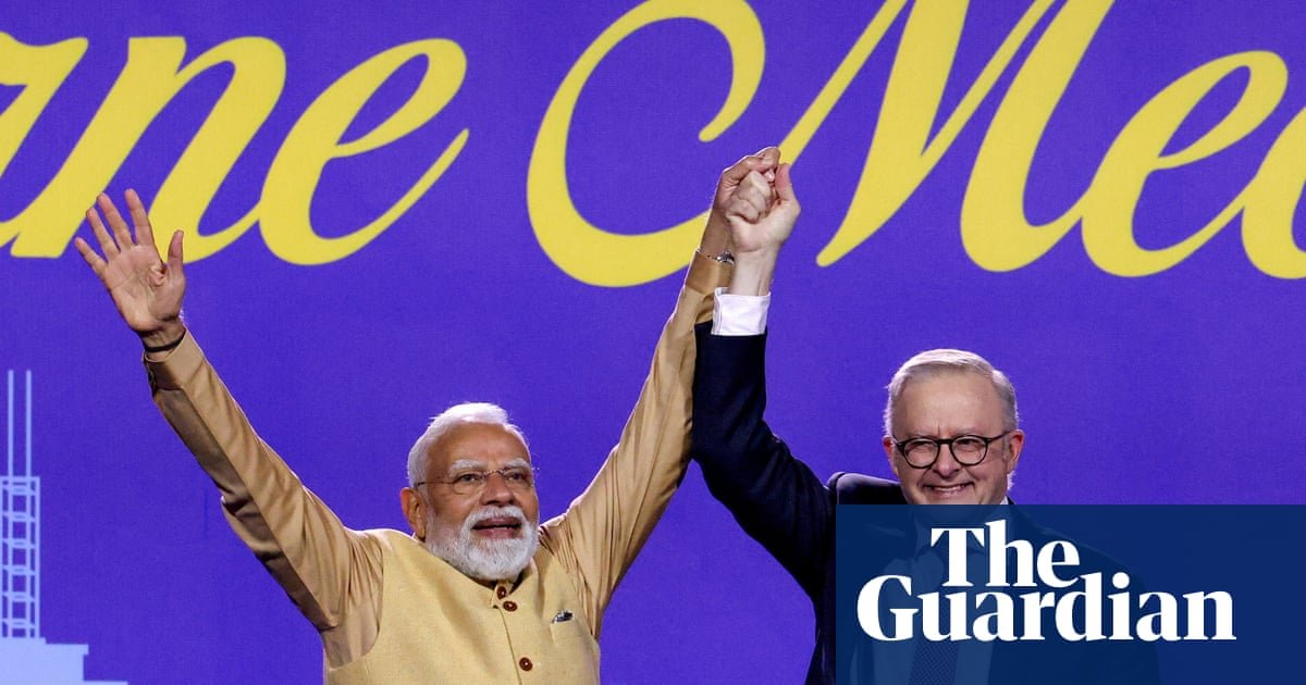 ‘Like a father to us’: pride and protest as thousands flock to see Narendra Modi in Melbourne