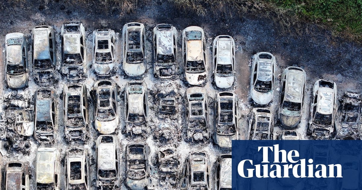 Man arrested on suspicion of arson after fire at car park used by Gatwick passengers