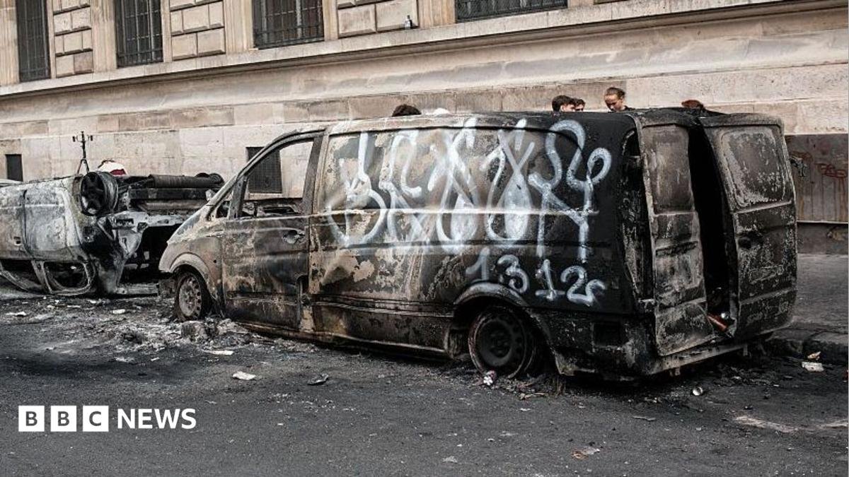 Suspect arrested after historic town hall set alight during disorder - French media