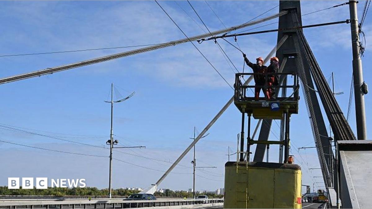 Kyiv bridge hit in further Russian drone attack as German chancellor makes surprise visit