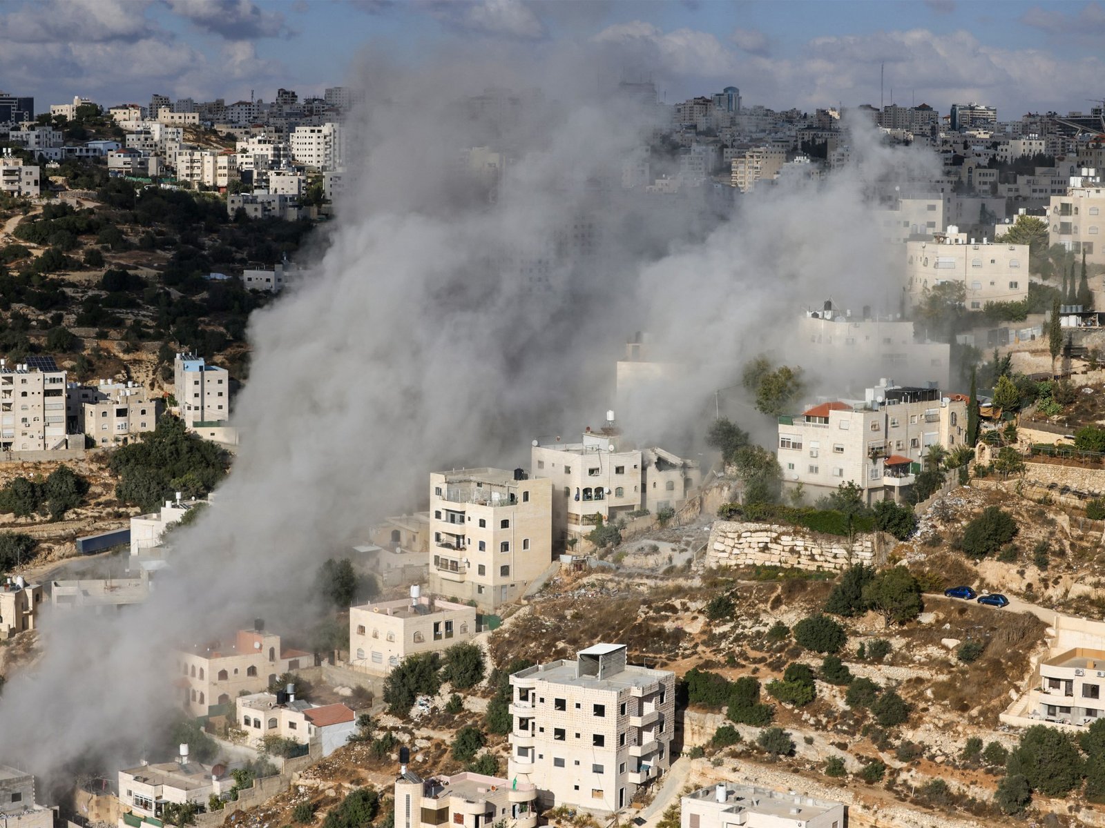 Israel demolishes homes of Palestinians blamed for attack on soldiers